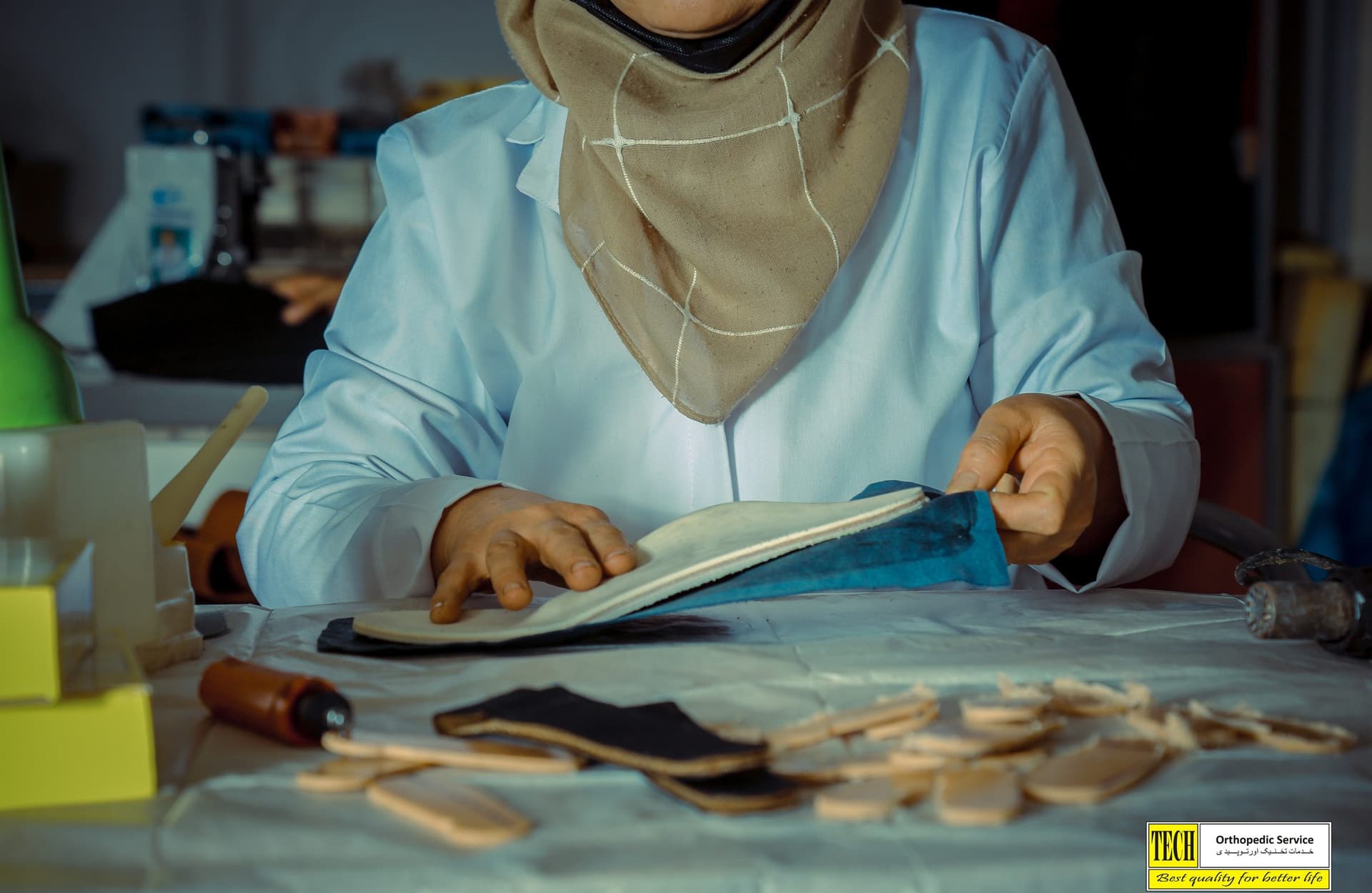 A technician handcrafting a custom orthotic insole at Tech Orthopedic Service