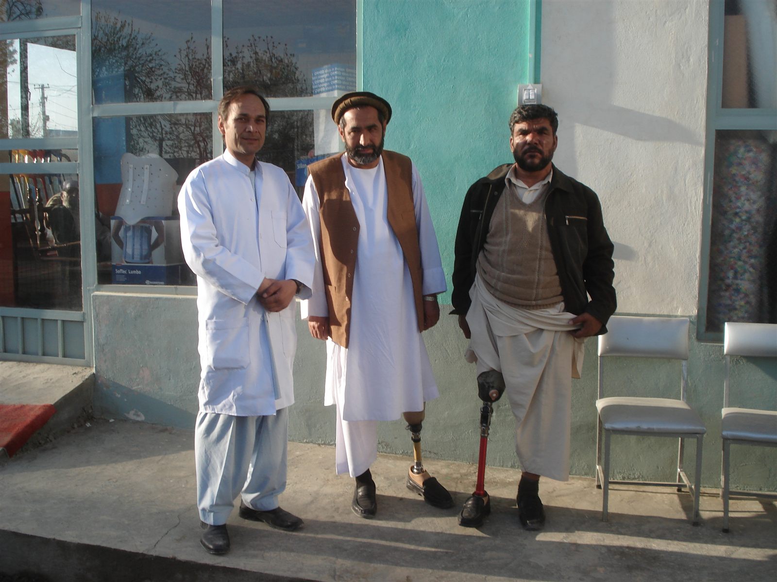 Standing again, outside the workshop